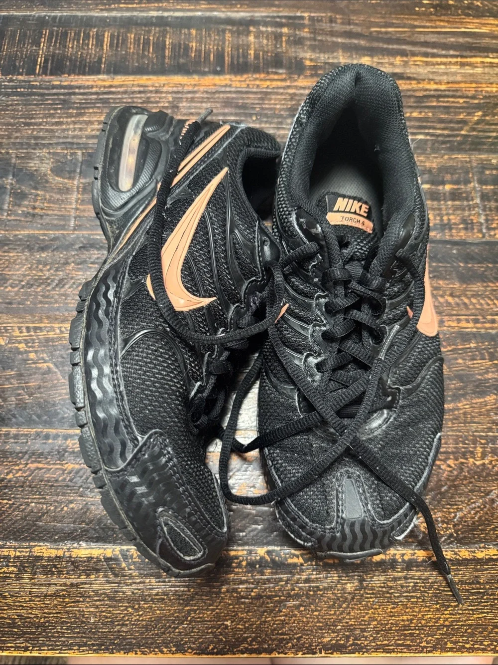 Nike Women's Black Running Sneakers with Copper Swoosh Accent